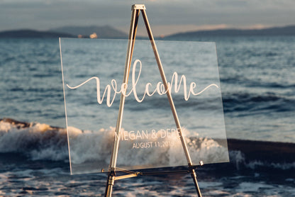 Acrylic wedding welcome sign with vinyl decal at a beach style wedding  