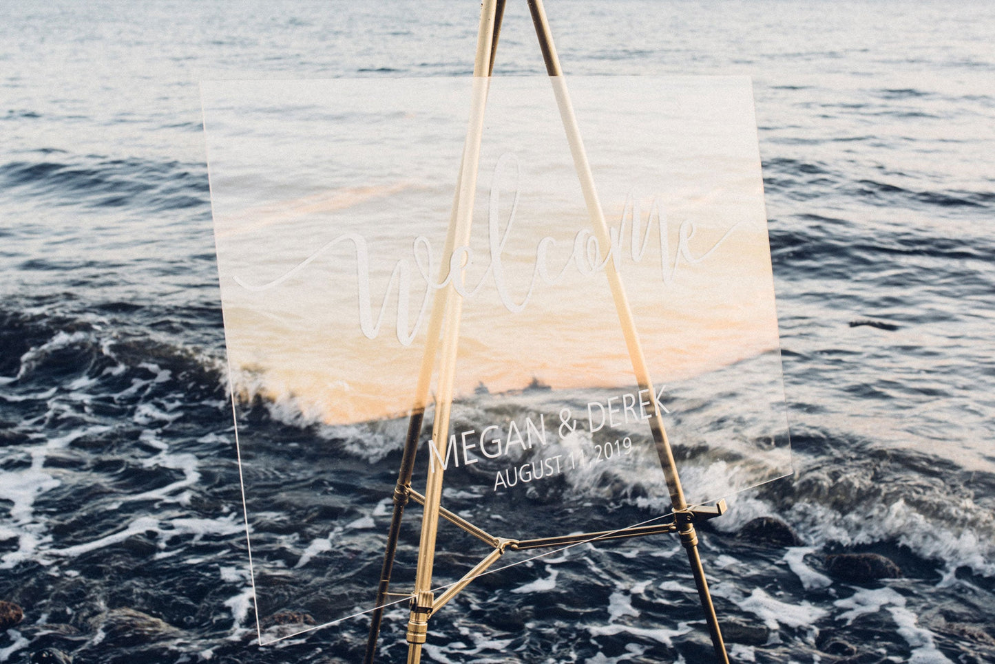 Acrylic wedding welcome sign with vinyl decal at a beach style wedding  
