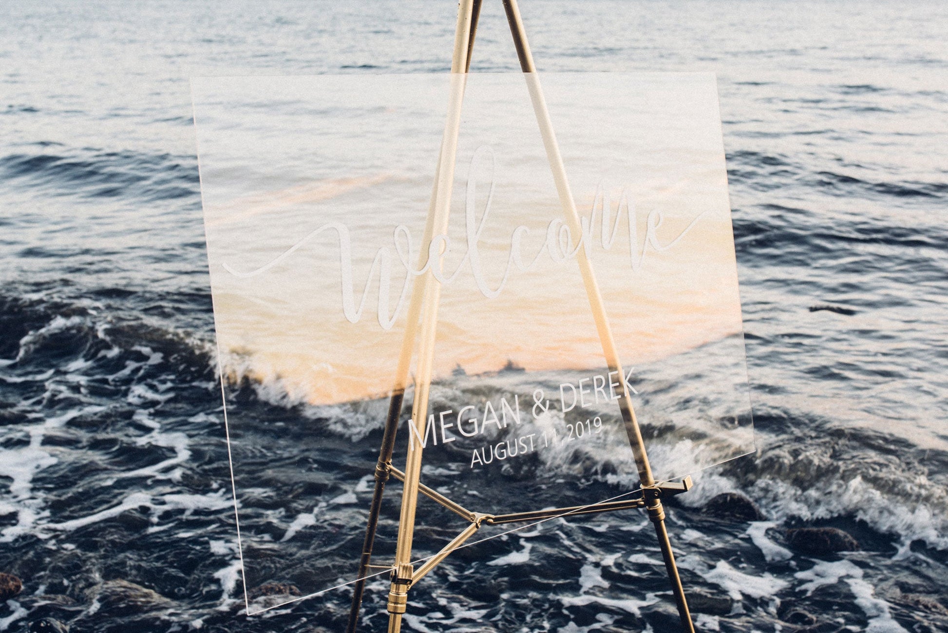 Acrylic wedding welcome sign with vinyl decal at a beach style wedding  